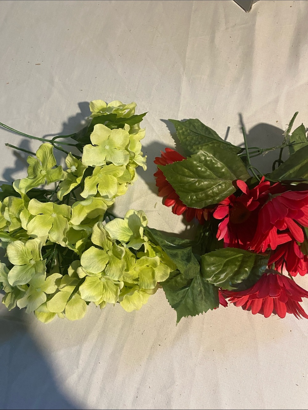 A mixture of Unbranded Artificial floral’s and green stem pieces